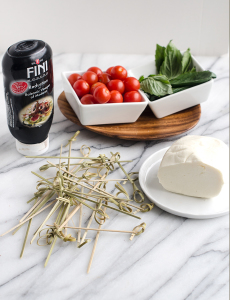 Easy Tomato and Basil Caprese Skewers make an awesome easy appetizer! They are incredibly easy to put together and will be eye catching (and delicious) for your next gathering.| www.chicandsugar.com